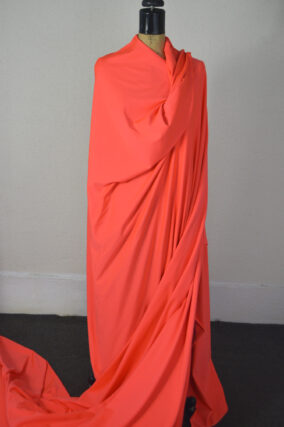 Coral Glo Polyester/Spandex Thermal Knit. One Lot of 15 Yards.